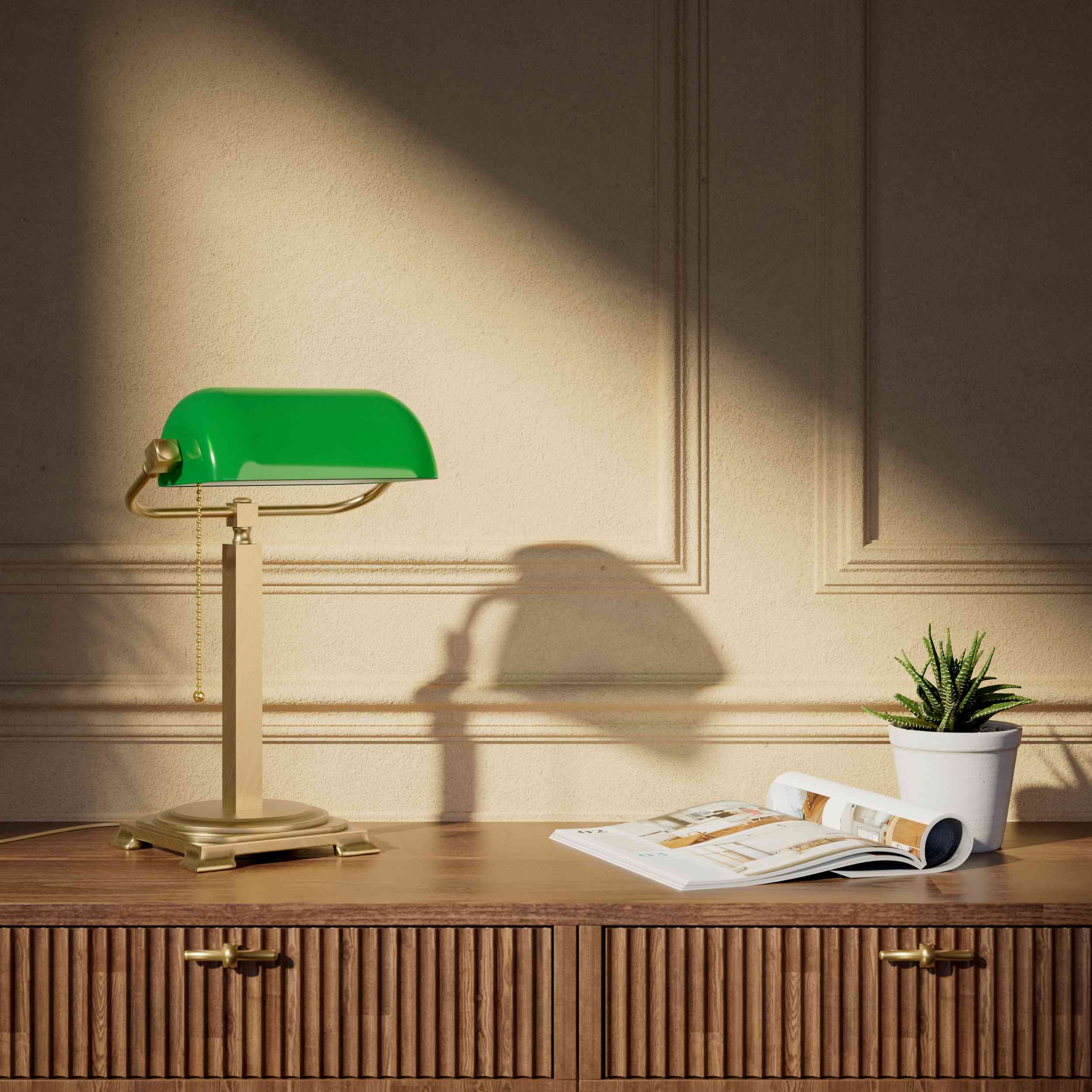 Executive library lamp with green glass shade and brass structure, decorative geometric base and golden pull chain by Ghidini 1849 - Finish: OBS Bronze Satin Brass