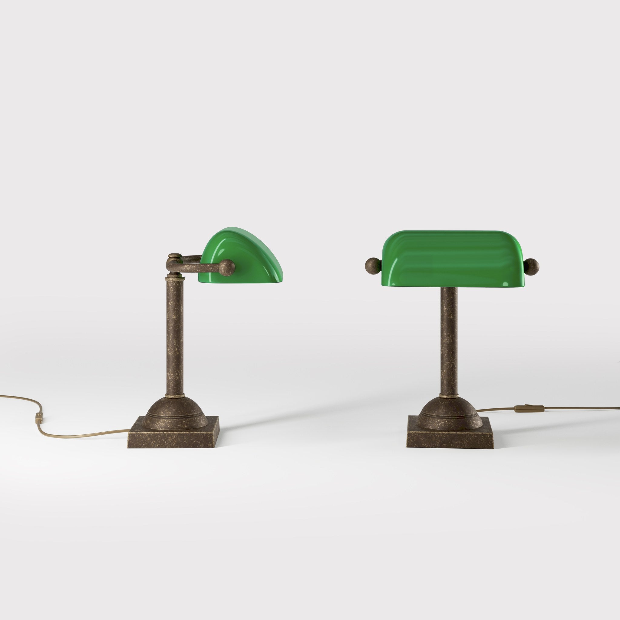 Compact banker's lamp with green glass shade and brass structure, square base and essential design by Ghidini 1849 - Finish: OAS Antique Brass