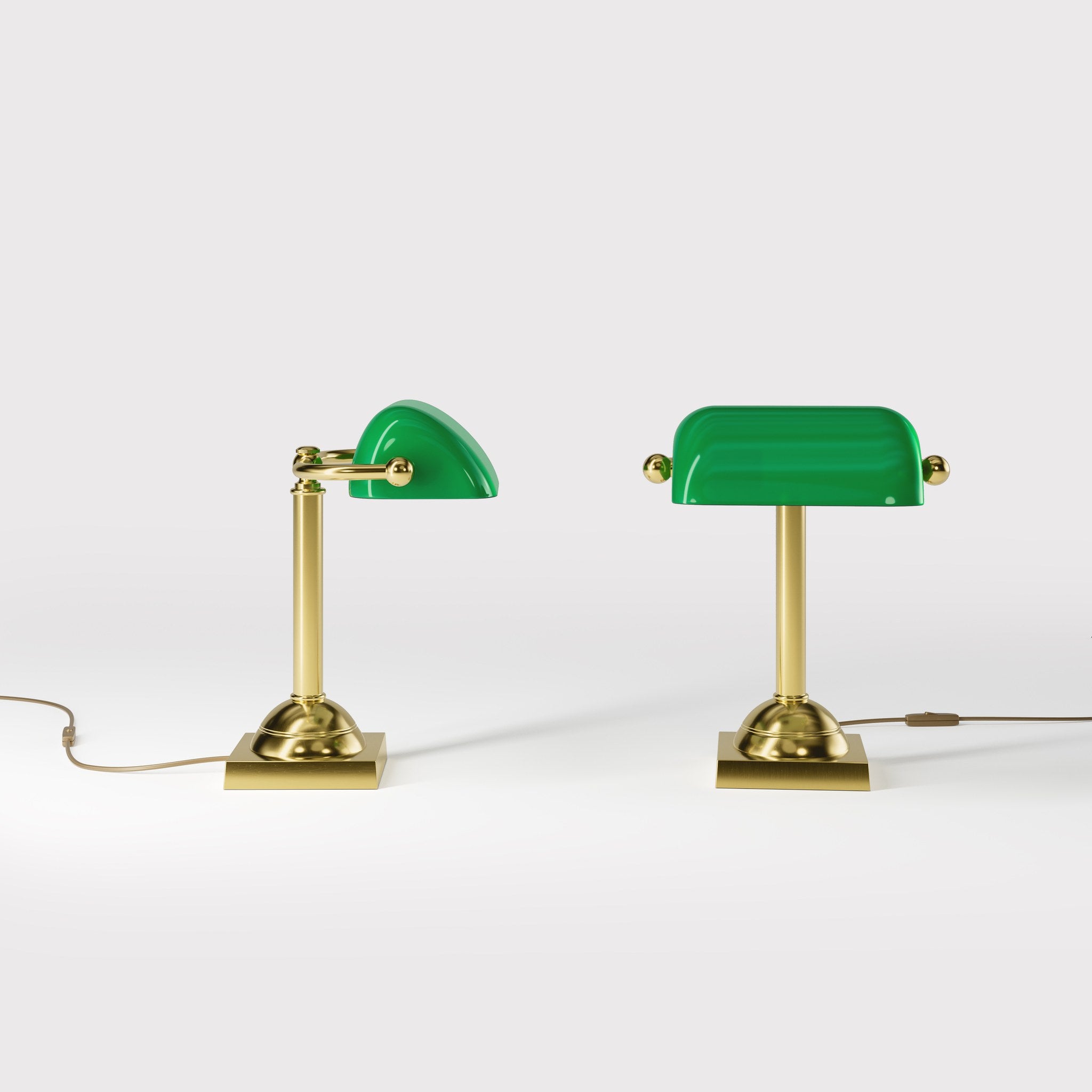 Compact banker's lamp with green glass shade and brass structure, square base and essential design by Ghidini 1849 - Finish: OLV Polished Brass