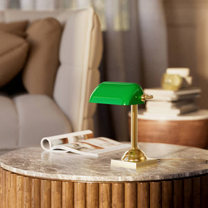 Compact banker's lamp with green glass shade and brass structure, square base and essential design by Ghidini 1849 - Finish: OLV Polished Brass