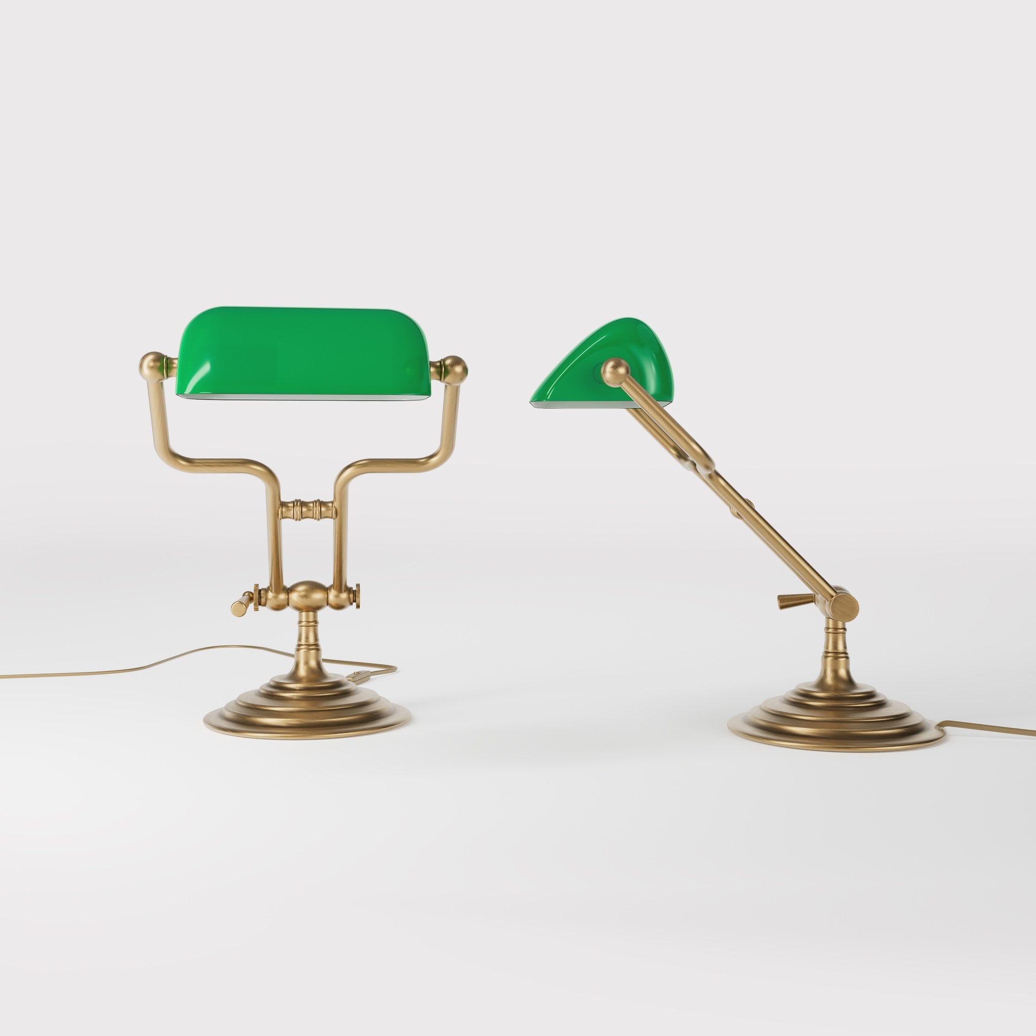 Small banker's lamp with green shade, adjustable brass arm and turned stepped base by Ghidini 1849 - Finish: OBS Bronze Satin Brass