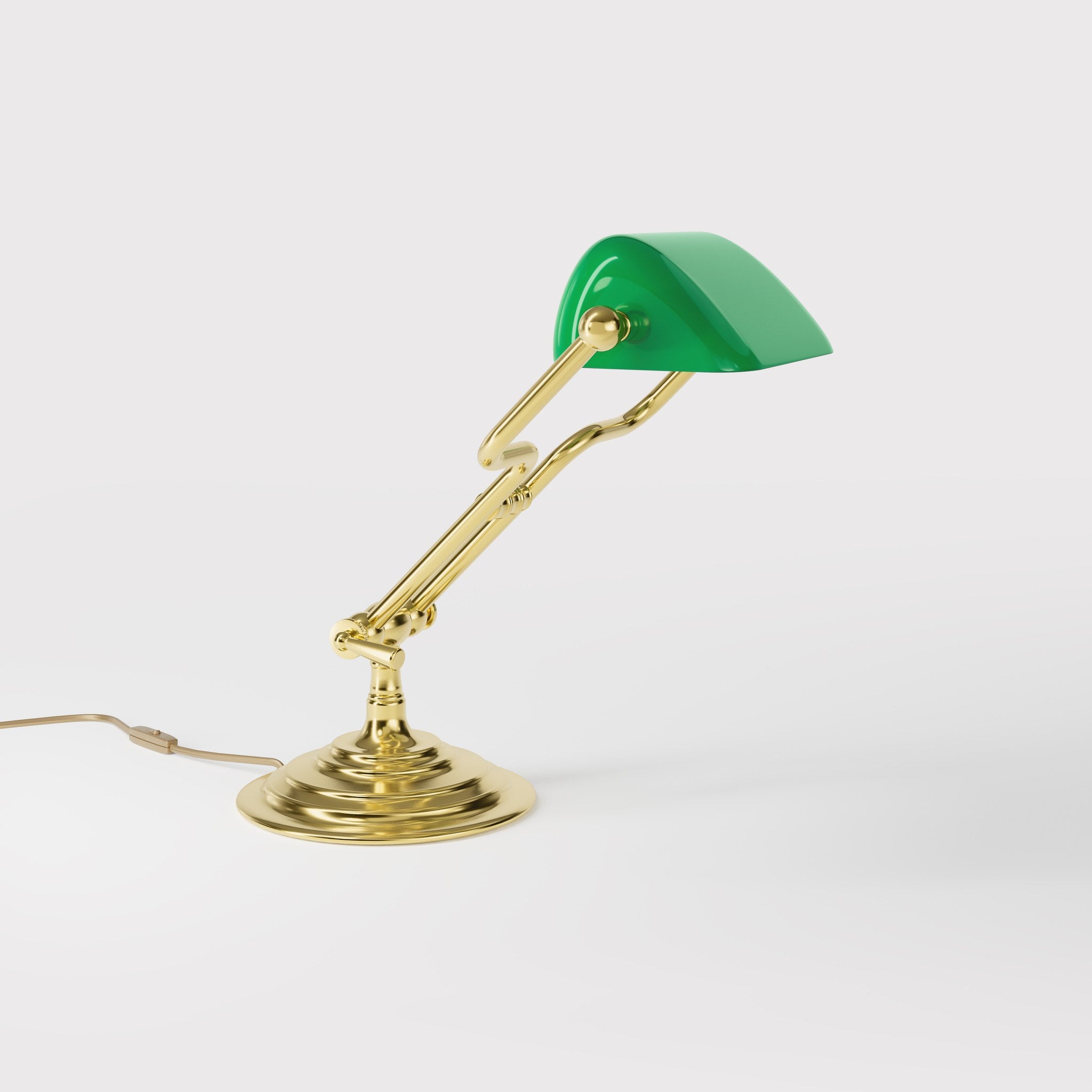 Small banker's lamp with green shade, adjustable brass arm and turned stepped base by Ghidini 1849 - Finish: OLV Polished Brass