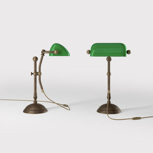 Compact banker's desk lamp with green shade, height-adjustable arm and brass structure by Ghidini 1849 | Finish: OAS Antique Brass