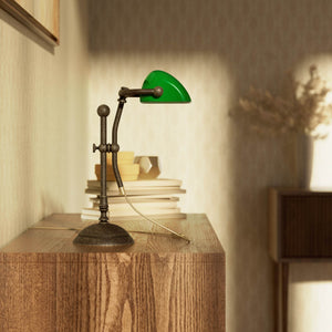 Compact banker's desk lamp with green shade, height-adjustable arm and brass structure by Ghidini 1849 | Finish: OAS Antique Brass
