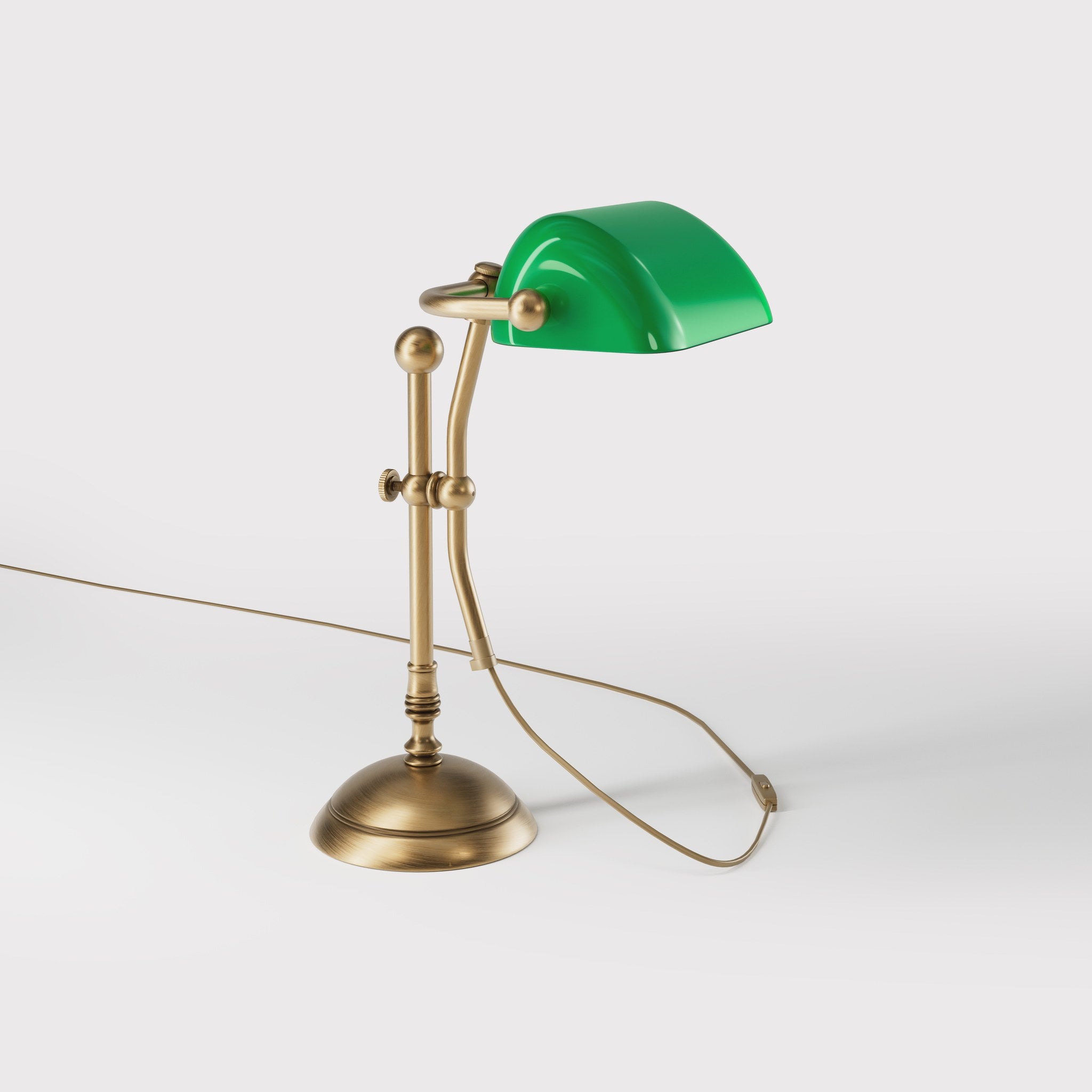 Compact banker's desk lamp with green shade, height-adjustable arm and brass structure by Ghidini 1849 | Finish: OBS Bronze Satin Brass