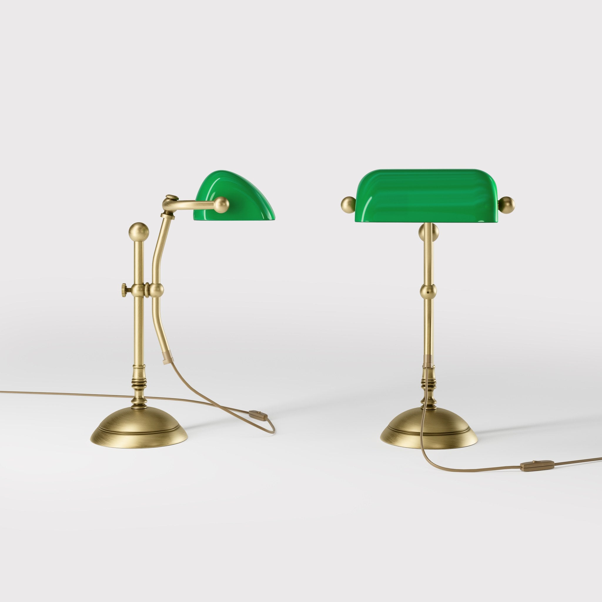 Compact banker's desk lamp with green shade, height-adjustable arm and brass structure by Ghidini 1849 | Finish: OBV Bronze Satin Light Brass