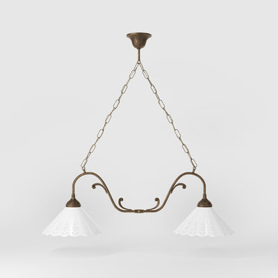 Art Nouveau pendant lamp with two pierced white ceramic shades, decorative brass arms and adjustable suspension chain by Ghidini 1849 - Finish: OAS Antique Brass
