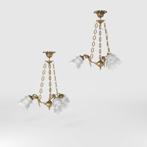 Art Nouveau chandelier with dancing brass putti and three frosted glass shades, decorated chains, floral motif rosette by Ghidini 1849 - Finish: OBS Bronze Satin Brass