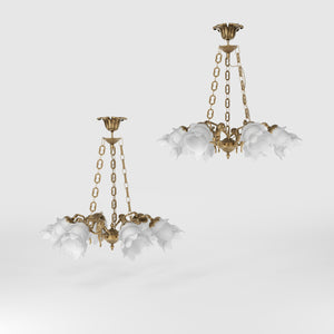 Art Nouveau chandelier with six brass putti and rose-shaped frosted glass shades, decorated chains and floral rosette by Ghidini 1849 - Finish: OBS Bronze Satin Brass