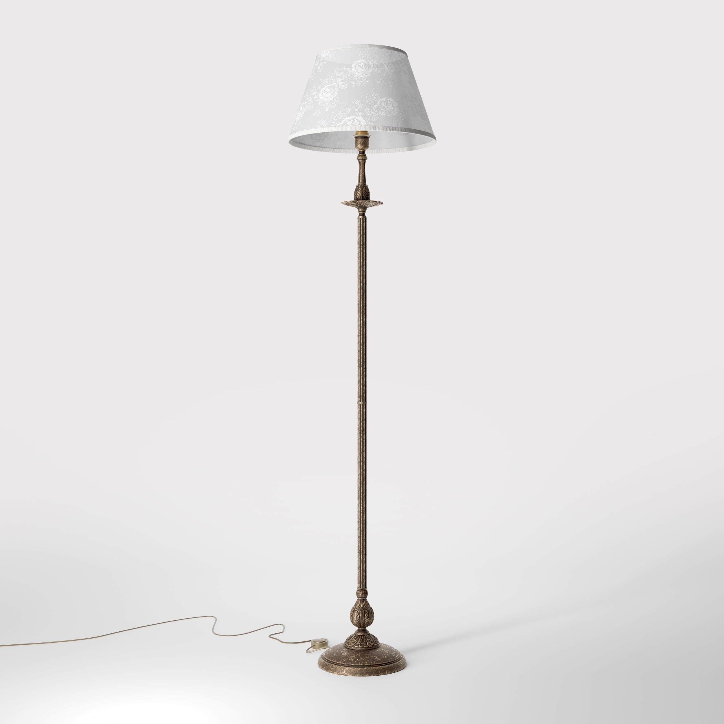 Classic brass floor lamp with decorated white fabric shade fluted stem ornamental base floral details traditional style - Finish: OAS Antique Brass
