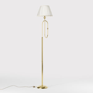 Brass floor lamp with trumpet arm and ivory pleated shade, musical design Made in Italy by Ghidini 1849 - Finish: OLV Polished Brass