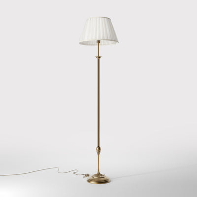Classic floor lamp Simona collection with decorated brass stem and large pleated ivory white fabric lampshade on ornamental base by Ghidini 1849 - Finish: OBS Bronze Satin Brass
