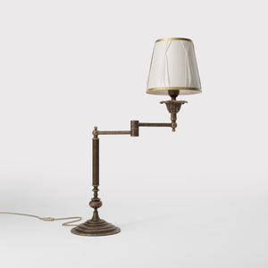 Classic brass table lamp with adjustable arm and ivory fabric shade, gold decorative trim, turned base London - Finish: OAS Antique Brass