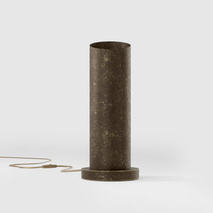 Brass table lamp with a sleek cylindrical shape and circular base, ideal for contemporary and elegant interiors by Ghidini 1849 - Finish: OAS Antique Brass