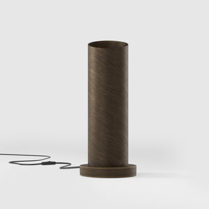 Brass table lamp with a sleek cylindrical shape and circular base, ideal for contemporary and elegant interiors by Ghidini 1849 - Finish: OBM Bronze Satin Matt Brass