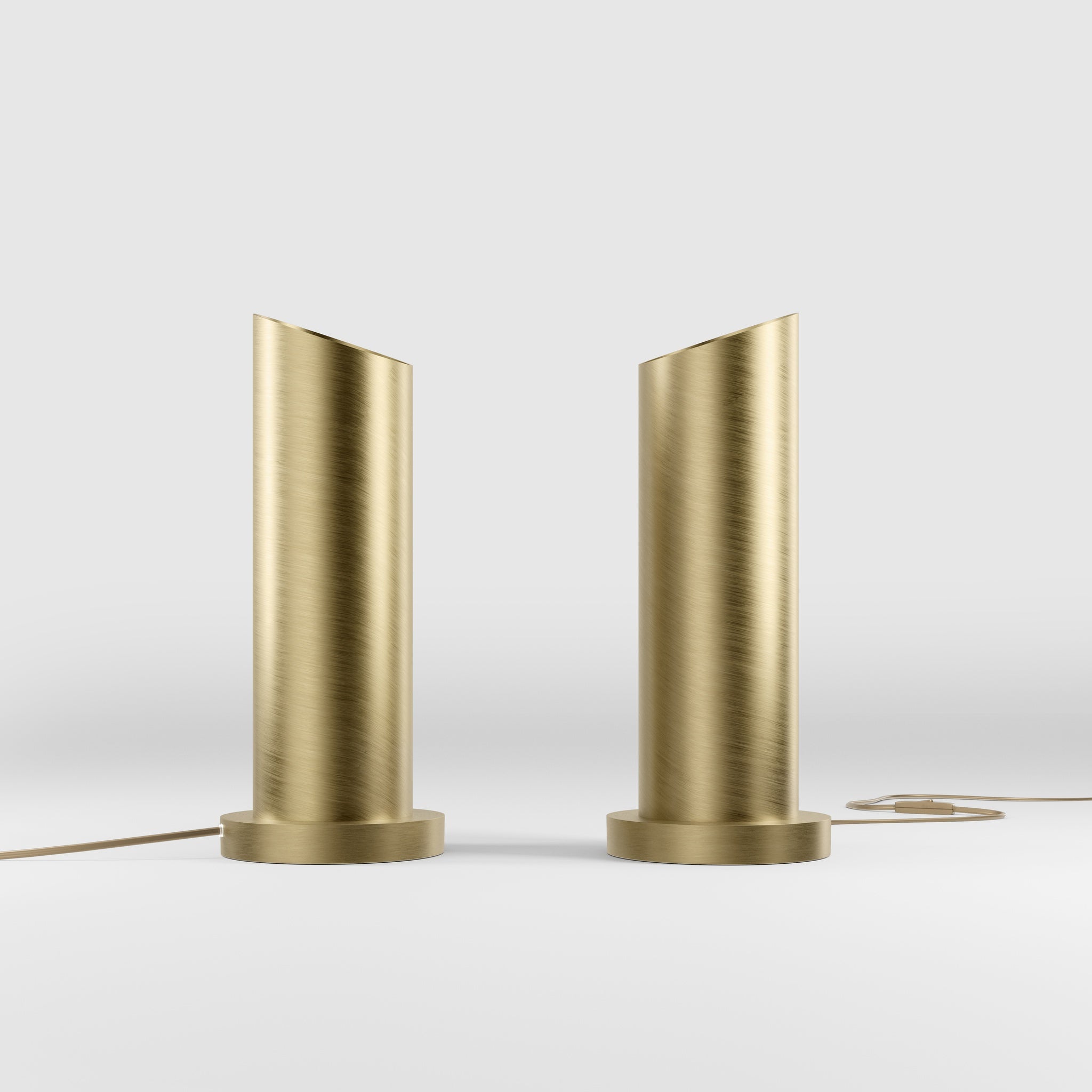 Brass table lamp with a sleek cylindrical shape and circular base, ideal for contemporary and elegant interiors by Ghidini 1849 - Finish: OBV Bronze Satin Light Brass
