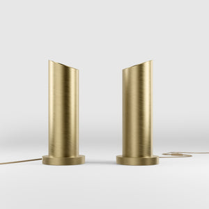 Brass table lamp with a sleek cylindrical shape and circular base, ideal for contemporary and elegant interiors by Ghidini 1849 - Finish: OBV Bronze Satin Light Brass