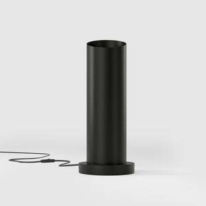 Brass table lamp with a sleek cylindrical shape and circular base, ideal for contemporary and elegant interiors by Ghidini 1849 - Finish: ONO Matt Black