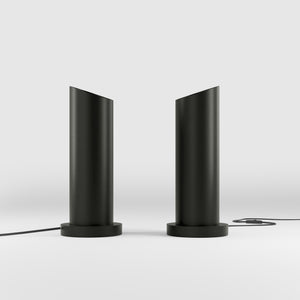 Brass table lamp with a sleek cylindrical shape and circular base, ideal for contemporary and elegant interiors by Ghidini 1849 - Finish: ONO Matt Black