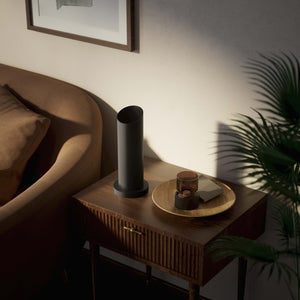 Brass table lamp with a sleek cylindrical shape and circular base, ideal for contemporary and elegant interiors by Ghidini 1849 - Finish: ONO Matt Black