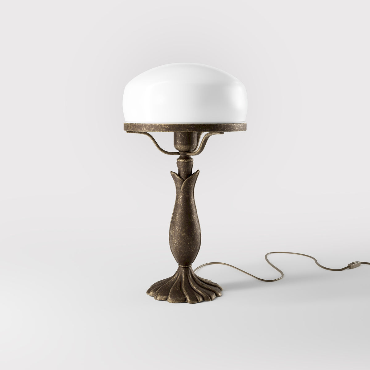 Art Deco table lamp with glossy white mushroom glass shade, sculpted brass base with undulating motifs, Italian design by Ghidini 1849 - Finish: OAS Antique Brass