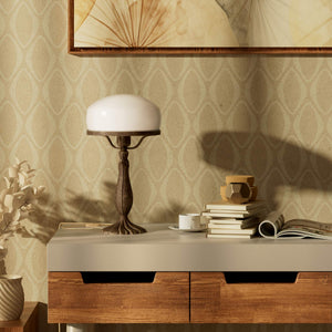 Art Deco table lamp with glossy white mushroom glass shade, sculpted brass base with undulating motifs, Italian design by Ghidini 1849 - Finish: OAS Antique Brass