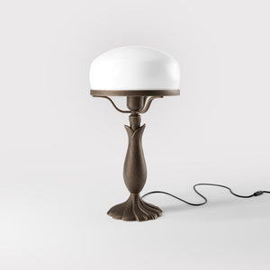Art Deco table lamp with glossy white mushroom glass shade, sculpted brass base with undulating motifs, Italian design by Ghidini 1849 - Finish: OBM Bronze Satin Matt Brass