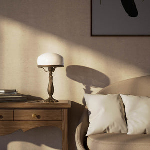 Art Deco table lamp with glossy white mushroom glass shade, sculpted brass base with undulating motifs, Italian design by Ghidini 1849 - Finish: OBM Bronze Satin Matt Brass