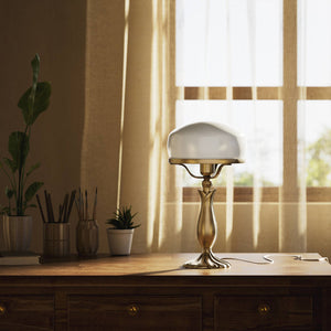 Art Deco table lamp with glossy white mushroom glass shade, sculpted brass base with undulating motifs, Italian design by Ghidini 1849 - Finish: OBS Bronze Satin Brass