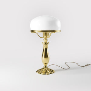 Art Deco table lamp with glossy white mushroom glass shade, sculpted brass base with undulating motifs, Italian design by Ghidini 1849 - Finish: OLV Polished Brass
