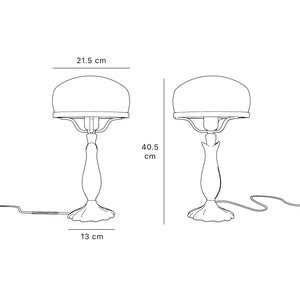 Art Deco table lamp with glossy white mushroom glass shade, sculpted brass base with undulating motifs, Italian design by Ghidini 1849