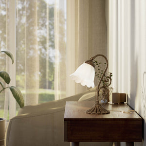 Art Deco table lamp with glossy white mushroom glass shade, sculpted brass base with undulating motifs, Italian design by Ghidini 1849 - Finish: OAS Antique Brass