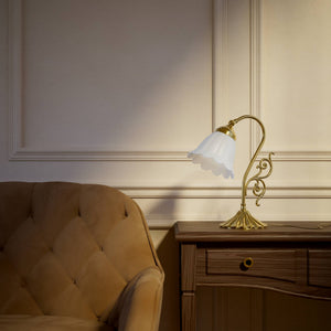 Art Deco table lamp with glossy white mushroom glass shade, sculpted brass base with undulating motifs, Italian design by Ghidini 1849 - Finish: OLV Polished Brass