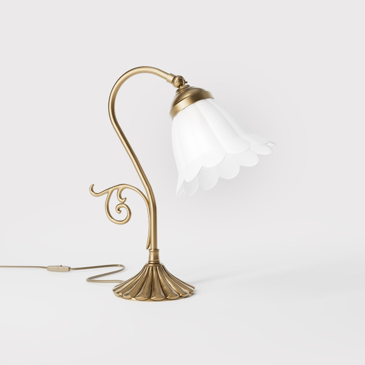Art Nouveau table lamp with frosted glass shade, scrollwork decorated arm and fan-shaped brass base, Italian design by Ghidini 1849 - Finish: OBS Bronze Satin Brass