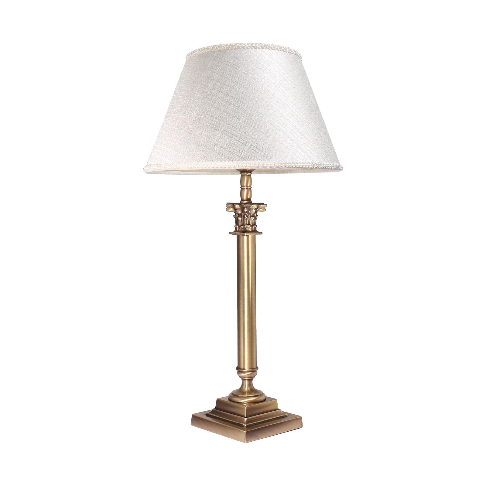 Brass table lamp with classic fabric shade in ivory white, decorative capital detail, ideal for elegant and timeless interiors