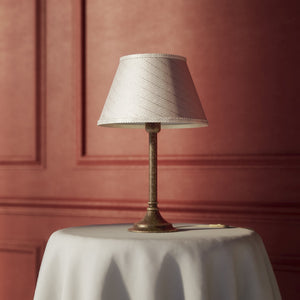 Brass table lamp with an ivory striped fabric shade, Made in Italy, timeless design by Ghidini 1849