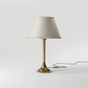 Brass table lamp with an ivory striped fabric shade, Made in Italy, timeless design by Ghidini 1849