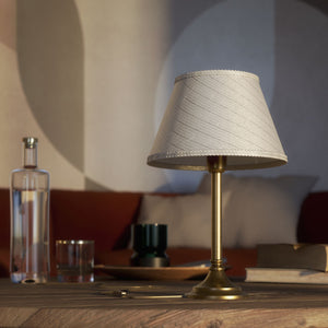 Brass table lamp with an ivory striped fabric shade, Made in Italy, timeless design by Ghidini 1849