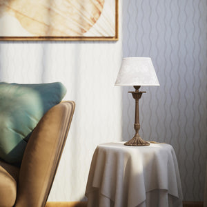 Classic brass table lamp with white fabric shade decorated with floral patterns, sculpted base with decorative elements by Ghidini 1849 - Finish: OAS Antique Brass