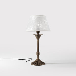 Classic brass table lamp with white fabric shade decorated with floral patterns, sculpted base with decorative elements by Ghidini 1849 - Finish: OBM Bronze Satin Matt Brass