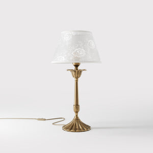 Classic brass table lamp with white fabric shade decorated with floral patterns, sculpted base with decorative elements by Ghidini 1849 - Finish: OBS Bronze Satin Brass