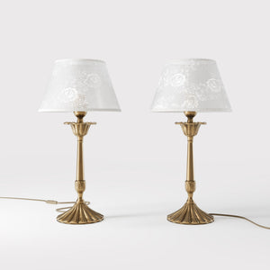 Classic brass table lamp with white fabric shade decorated with floral patterns, sculpted base with decorative elements by Ghidini 1849 - Finish: OBS Bronze Satin Brass