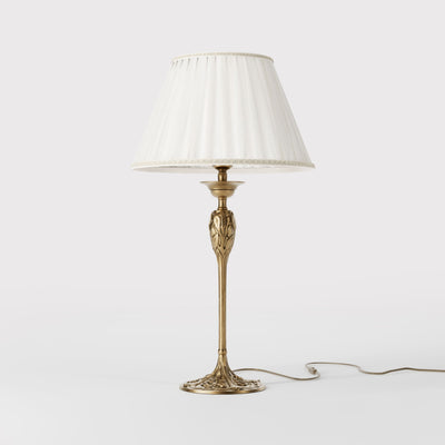 Liberty style table lamp Simona collection with decorated brass base featuring floral motifs and pleated ivory white fabric lampshade by Ghidini 1849 - Finish: OBS Bronze Satin Brass