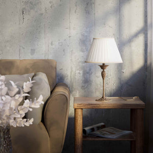 Art Nouveau table lamp Simona collection with decorated brass base featuring floral motifs and pleated ivory white fabric lampshade by Ghidini 1849 - Finish: OAS Antique Brass