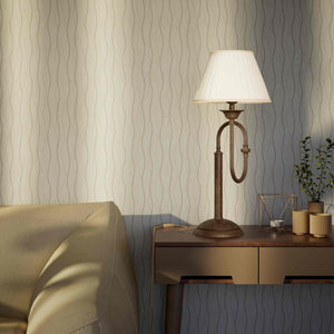 Brass table lamp with trombone-style design, ivory pleated shade, adjustable arm and decorated base, musical design Made in Italy by Ghidini 1849 - Finish: OAS Antique Brass