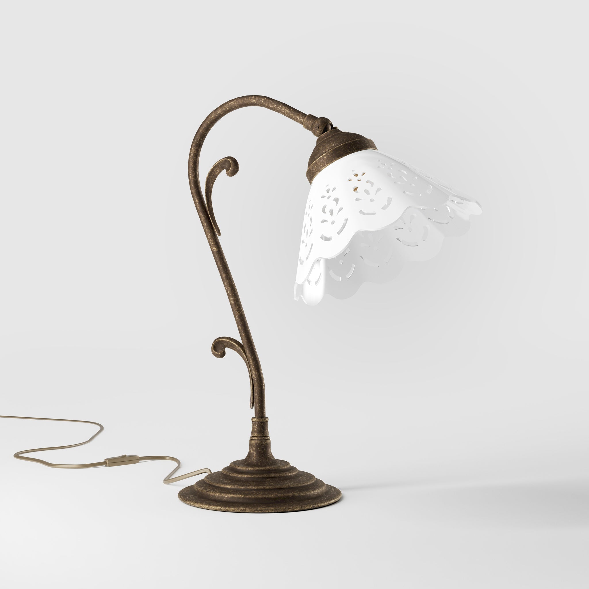 Art Nouveau table lamp with white pierced ceramic shade and decorative curved adjustable brass arm structure by Ghidini 1849 - Finish: OAS Antique Brass