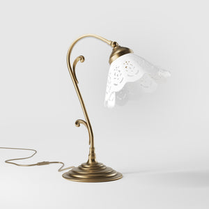 Art Nouveau table lamp with white pierced ceramic shade and decorative curved adjustable brass arm structure by Ghidini 1849 - Finish: OBS Bronze Satin Brass