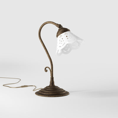 Liberty style table lamp with white pierced ceramic shade stepped base and decorative adjustable brass arm by Ghidini 1849 - Finish: OAS Antique Brass