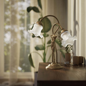 Art Nouveau table lamp in brass with sculptural female figure and two wavy frosted glass shades, decorated base by Ghidini 1849 - Finish: OAS Antique Brass