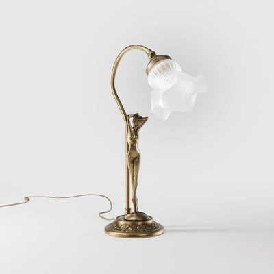 Liberty table lamp in brass with sculptural female figure and wavy frosted glass shade, base decorated with floral motifs by Ghidini 1849 - Finish: OBS Bronze Satin Brass